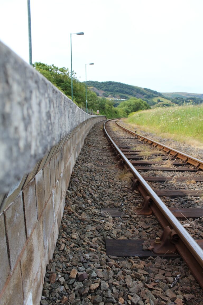 a train track running through a rural countryside